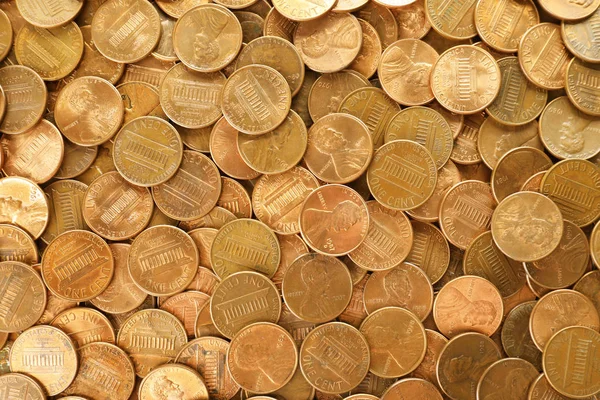 Stapel van Shiny USA One cent munten als achtergrond, bovenaanzicht — Stockfoto
