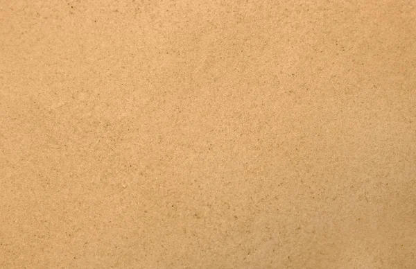 Сухой пляжный песок в качестве фона, вид сверху — стоковое фото