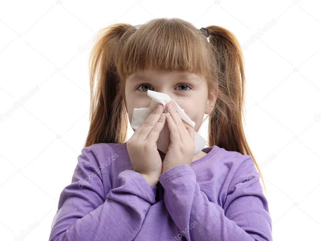 Cute little girl blowing nose against white background