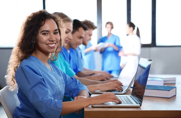 Smart medical student with her classmates in college