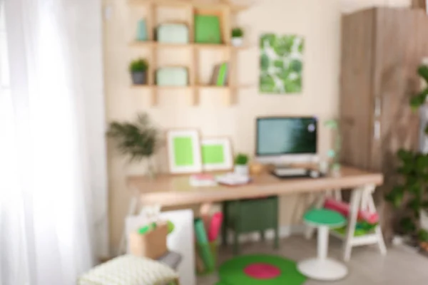 Blurred view of comfortable workplace with computer at home — Stock Photo, Image