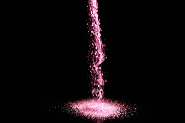 Ψέκασμα ροζ glitter σε μαύρο φόντο, bokeh αποτέλεσμα — Φωτογραφία Αρχείου