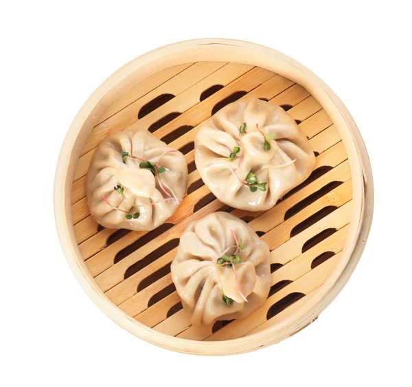 stock image Bamboo steamer with tasty baozi dumplings on white background, top view