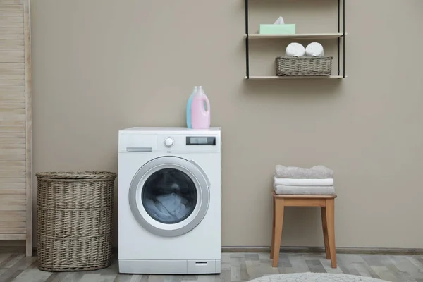 Washing machine with dirty towel in laundry room — Stock Photo, Image