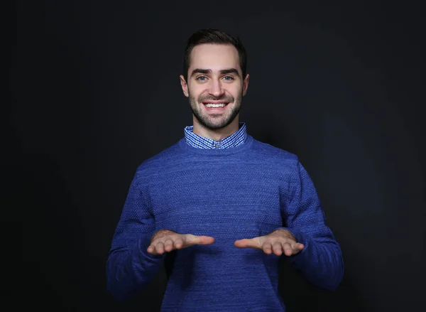 Man showing BLESS gesture in sign language on black background — Stock Photo, Image