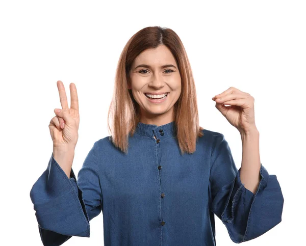 Femme utilisant le langage des signes sur fond blanc — Photo