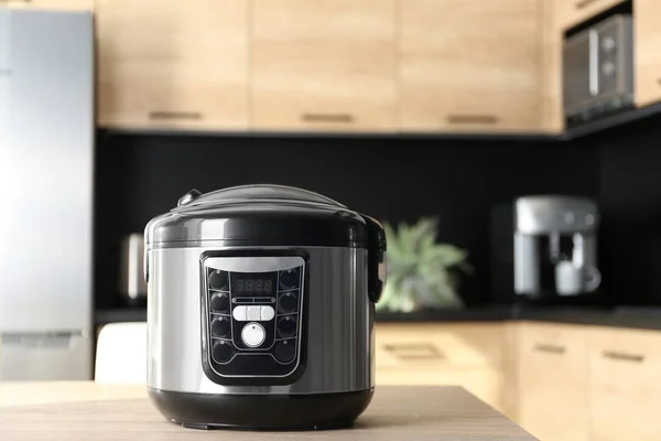 Modern multi cooker on table in kitchen, space for text — Stock Photo, Image