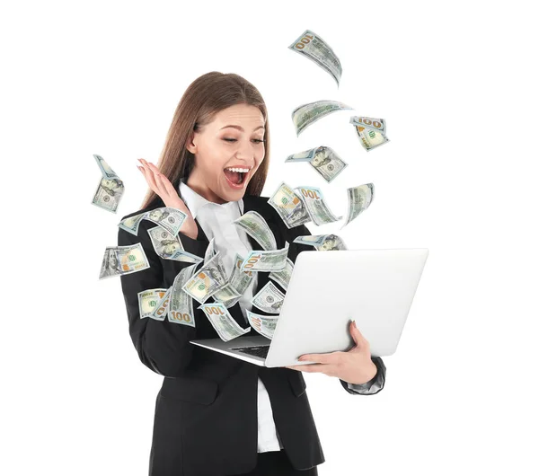 Glückliche Geschäftsfrau mit Laptop feiert Sieg und fliegende amerikanische Dollars auf weißem Hintergrund — Stockfoto