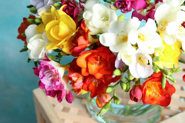 Beautiful spring bright freesia flowers on stand, closeup — Stock Photo, Image