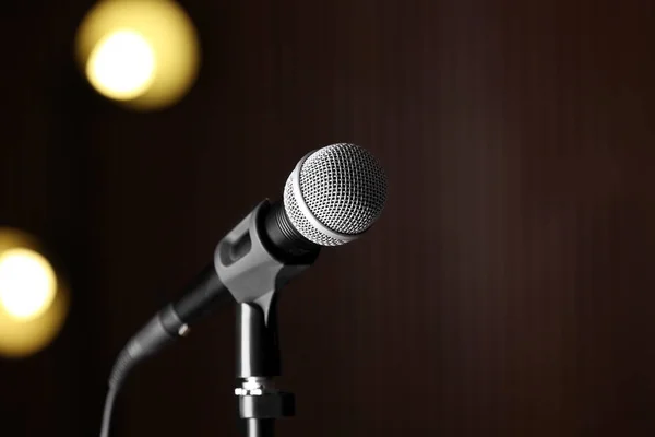 Microphone against festive lights, space for text — Stock Photo, Image