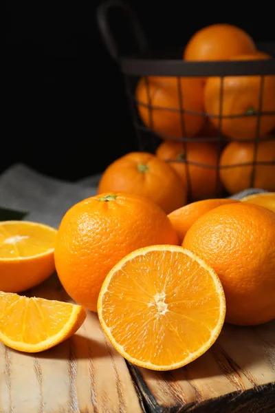 Wooden board with ripe oranges on table. Space for text — Stock Photo, Image