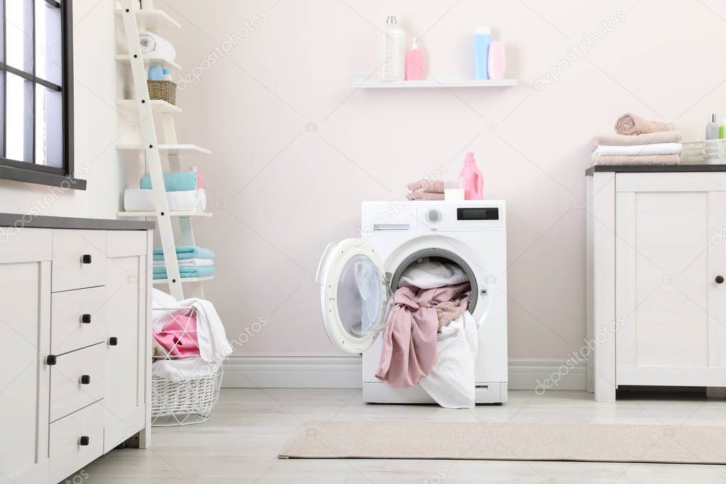Bathroom interior with dirty towels in washing machine