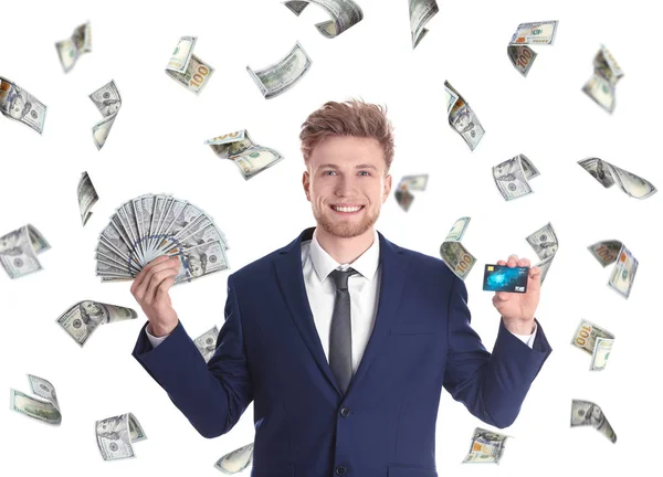 Χαρούμενος νεαρός επιχειρηματίας με χρήματα και πιστωτικών καρτών σε λευκό φόντο — Φωτογραφία Αρχείου