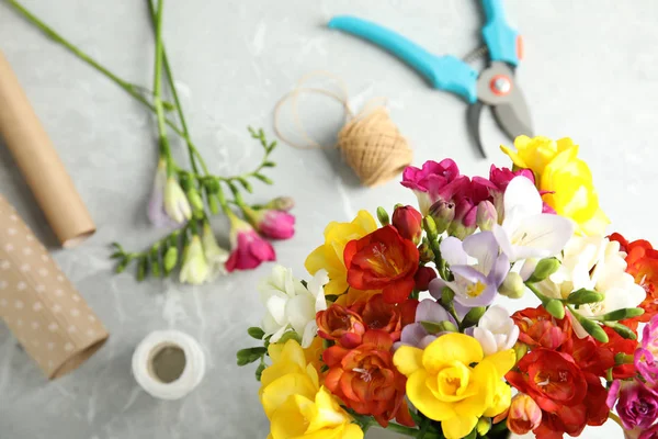 Flat lay composition with freesia flowers on table — Stock Photo, Image