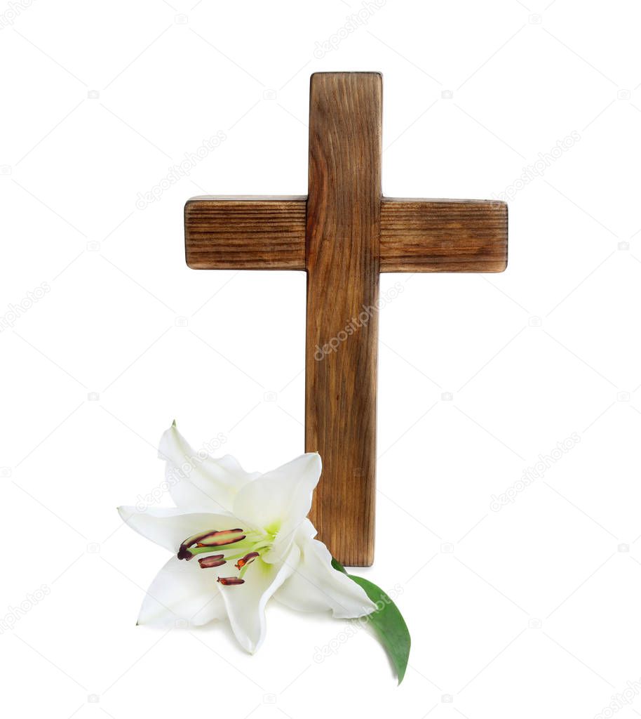 Wooden cross and blossom lily on white background