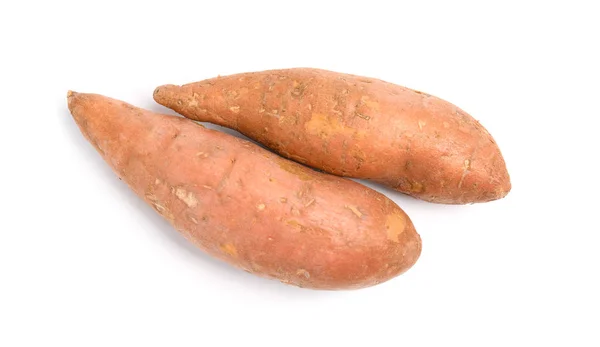 Hele rijpe zoete aardappelen op witte achtergrond, bovenaanzicht — Stockfoto