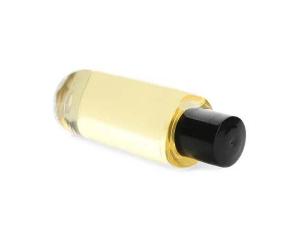 Mini láhev s kosmetickým přípravkem na bílém podkladu. Hotelová amennost — Stock fotografie