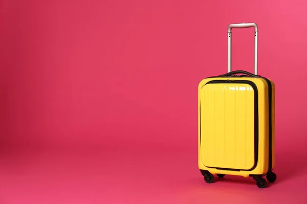 Stylish suitcase on color background. Space for text — Stock Photo, Image