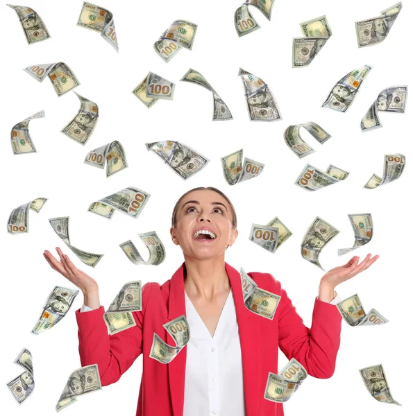 Gelukkige jonge zakenvrouw onder regen van geld op witte achtergrond — Stockfoto