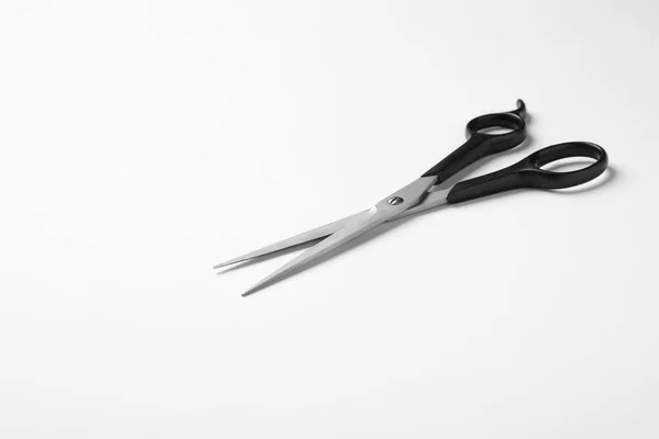 New scissors on white background. Professional hairdresser tool — Stock Photo, Image