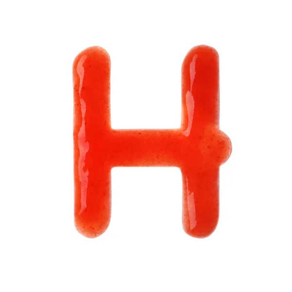 Буква H написана с красным соусом на белом фоне — стоковое фото