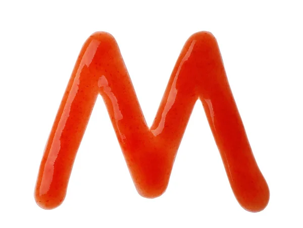 Písmeno M napsané s červenou omáčkou na bílém pozadí — Stock fotografie
