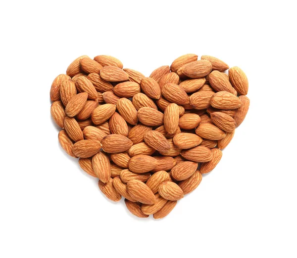 Heart made of almonds on white background, top view. Healthy diet — Stock Photo, Image
