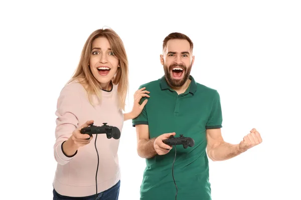 Emotional couple playing video games with controllers isolated on white — Stock Photo, Image