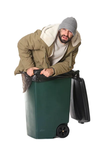 Poor homeless man in trash bin isolated on white — Stock Photo, Image