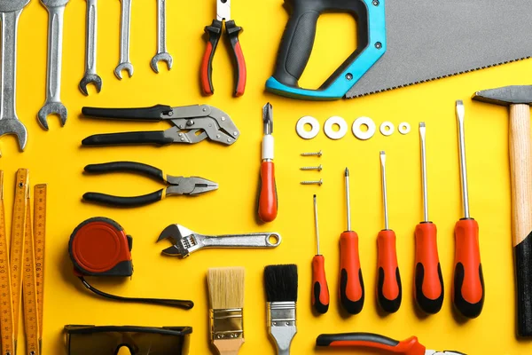 Flat lay composition with construction tools on color background — Stock Photo, Image