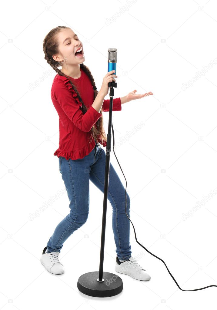 Cute girl singing in microphone on white background