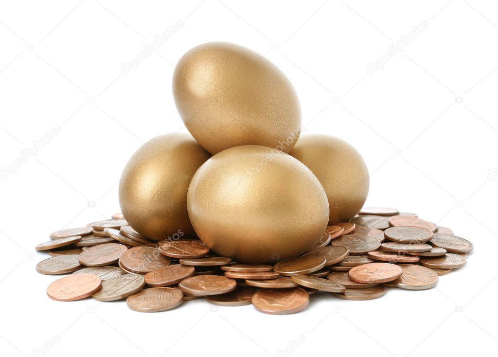 Gold eggs with coins on white background