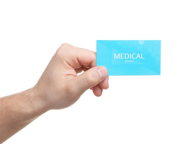 Homem segurando cartão de visita isolado em branco, close up. Serviço médico — Fotografia de Stock