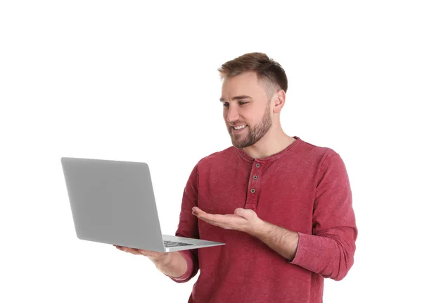 Hombre joven utilizando el chat de vídeo en el ordenador portátil contra el fondo blanco —  Fotos de Stock