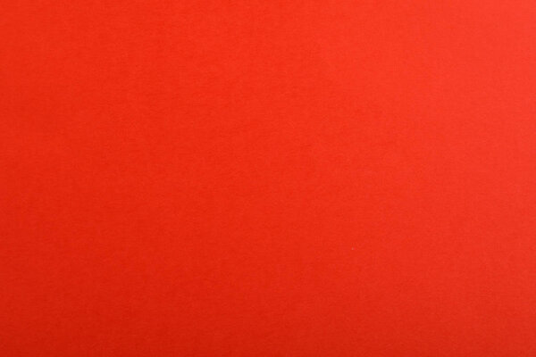 Абстрактный красный фон, вид сверху. Красочная бумага

