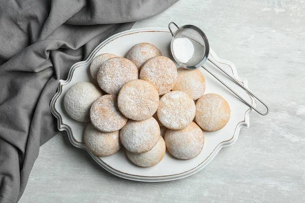 Traditional cookies for Islamic holidays and strainer with powdered sugar on table, top view. Eid Mubarak — Stock Photo, Image