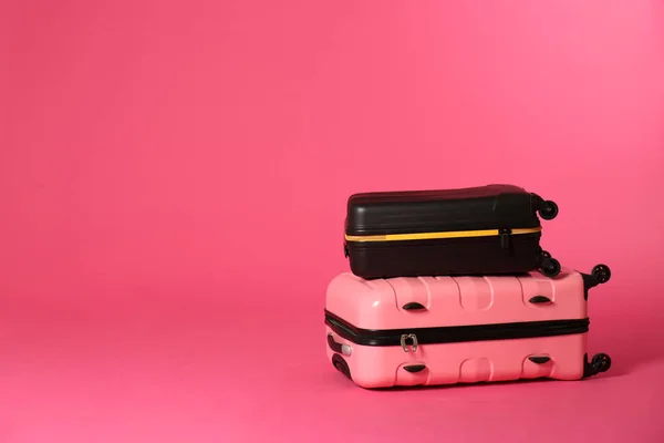 Stylish suitcases on color background. Space for text — Stock Photo, Image