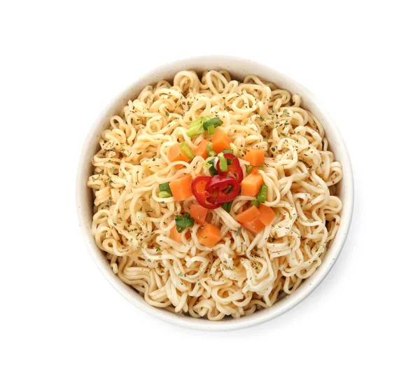 Tasty instant noodles with vegetables in bowl isolated on white, top view — Stock Photo, Image