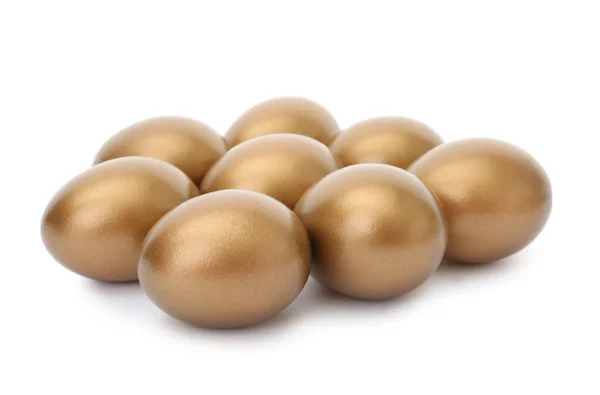 흰색 바탕에 많은 빛나는 황금 계란 — 스톡 사진