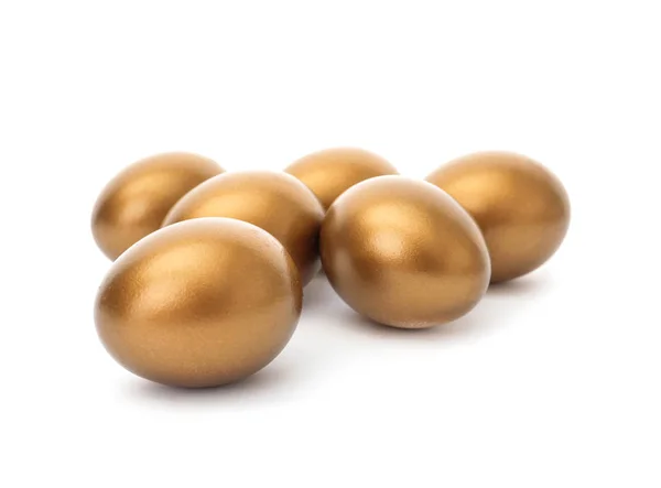 Many shiny golden eggs on white background — Stock Photo, Image