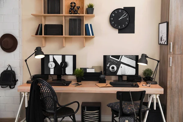 Stylish workplace interior with computers on table — Stock Photo, Image