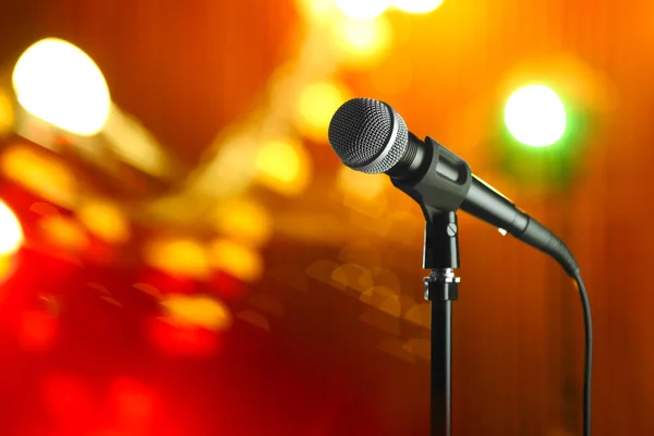 Microphone against festive lights, space for text — Stock Photo, Image
