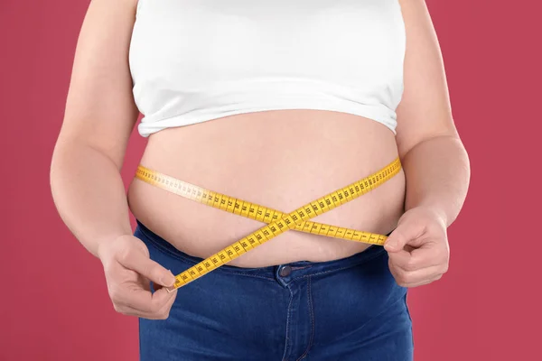 A Fat Woman Measures Her Waist with a Measuring Tape, Close-up.Weight Loss,  Obesity. Woman after Childbirth. Stock Photo - Image of obesity, excess:  283778752