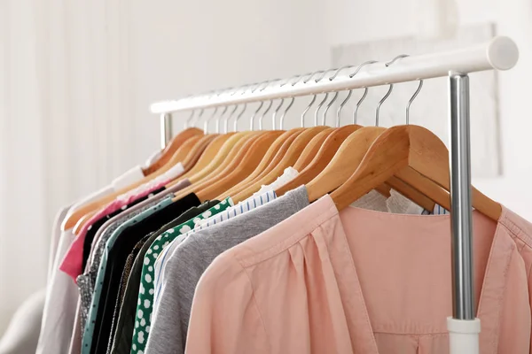 Wardrobe rack with stylish clothes indoors, closeup — Stock Photo, Image