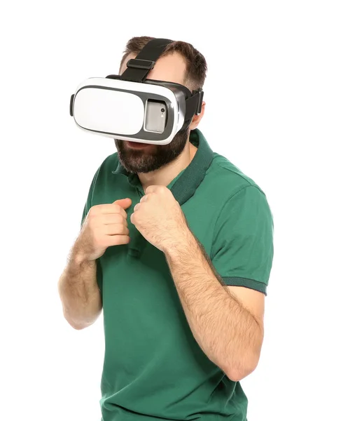 Jovem emotivo jogando videogames com fone de ouvido de realidade virtual isolado em branco — Fotografia de Stock