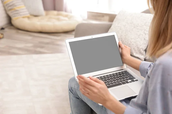 Young woman using video chat on laptop in living room, closeup. Space for design — Stock Photo, Image