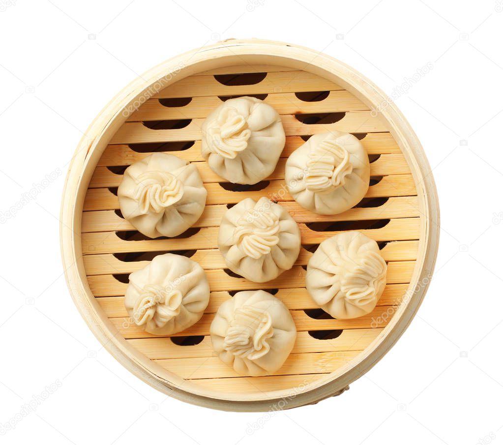 Bamboo steamer with tasty dumplings isolated on white