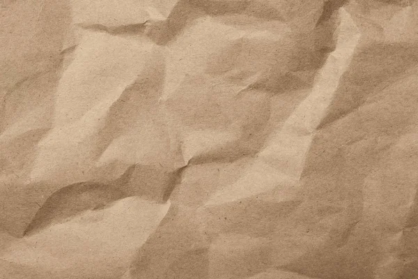 Arka plan olarak kahverengi buruşturulmuş kağıt dokusu, üst görünüm — Stok fotoğraf