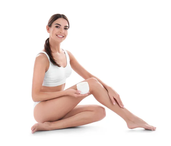 Young woman with jar of cream on white background. Beauty and body care Stock Picture