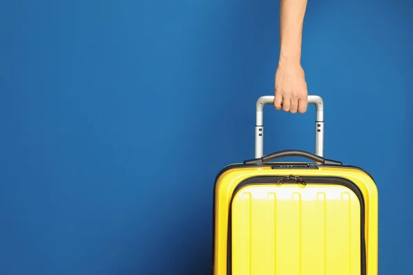 Woman with stylish suitcase against color background, closeup. Space for text — 스톡 사진